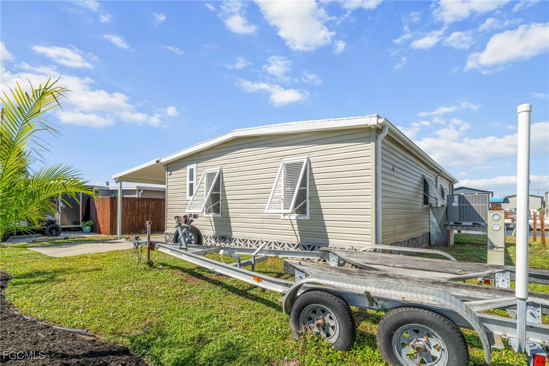 2971 York Road St. James City, FL 33956 - Photo 21 of 23 a front view of a house with garden