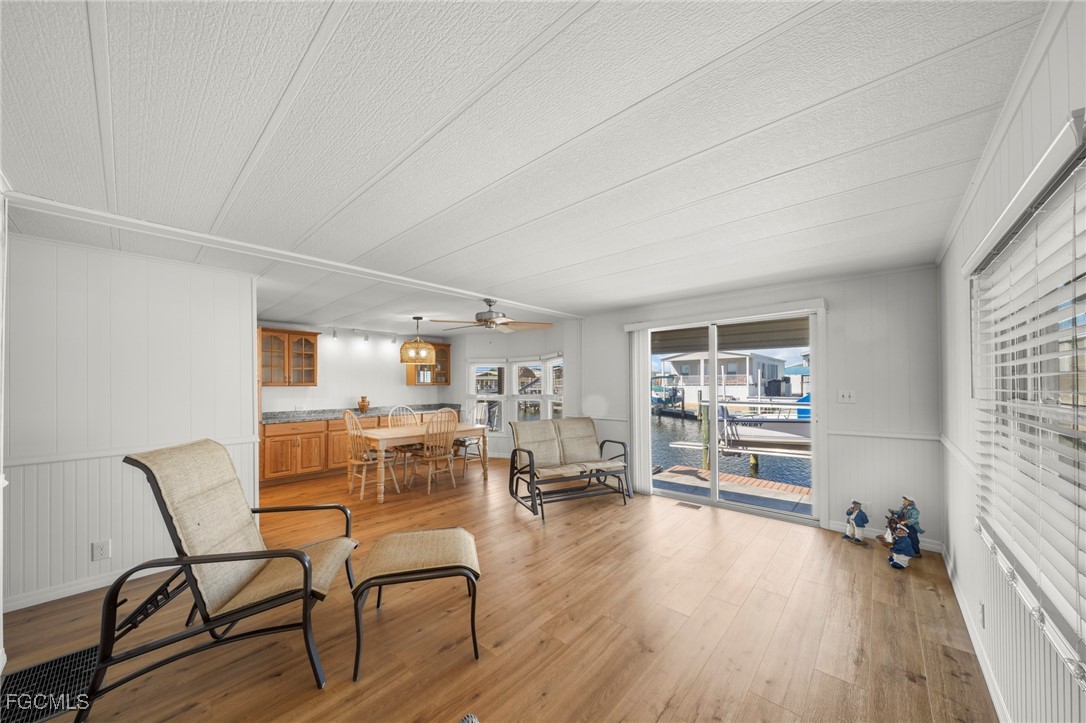 2971 York Road St. James City, FL 33956 - Photo 7 of 23 a living room with furniture and a wooden floor