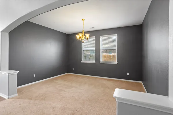 a bedroom with window and ceiling fan