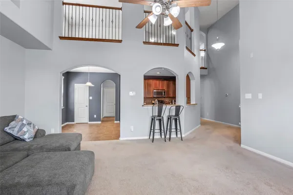 a view of a livingroom with furniture and chandelier