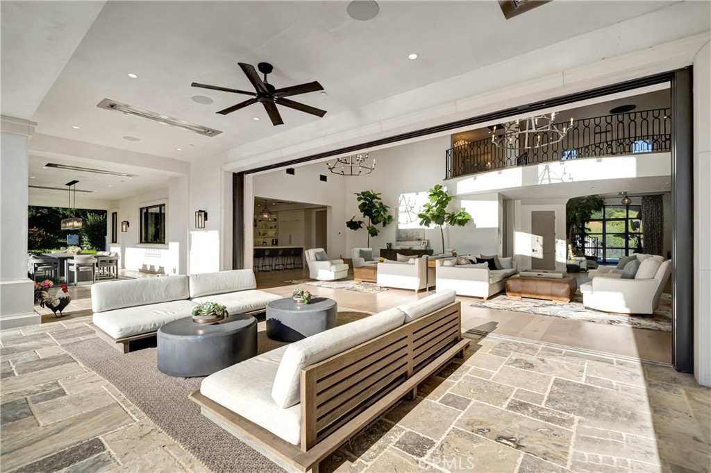 2037 Delphine Lane Calabasas, CA 91302 - Photo 12 of 75 a living room with patio furniture and a large window