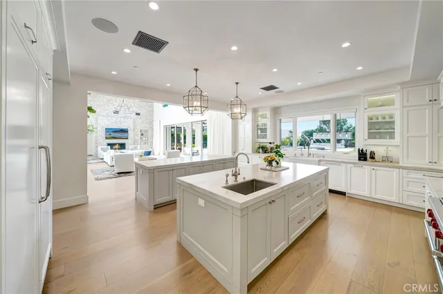 a bathroom with a sink a toilet a mirror and vanity
