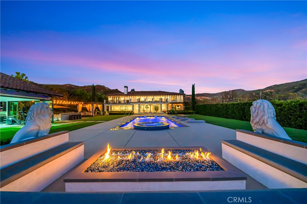 2037 Delphine Lane Calabasas, CA 91302 - Photo 2 of 75 a view of a swimming pool with a yard