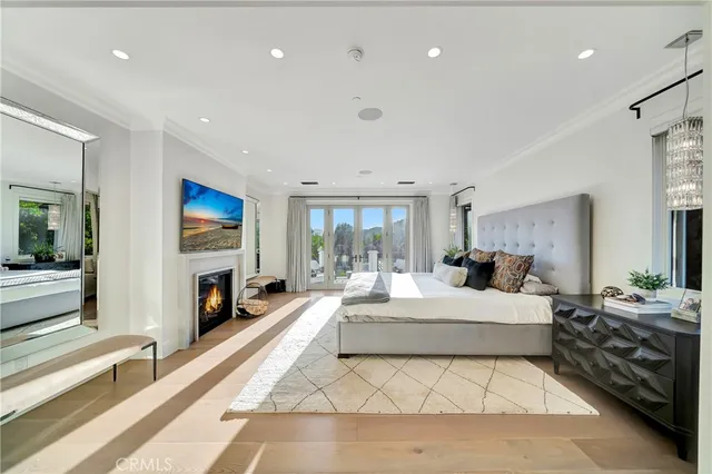 a bathroom with a toilet a sink a mirror a bathtub and vanity