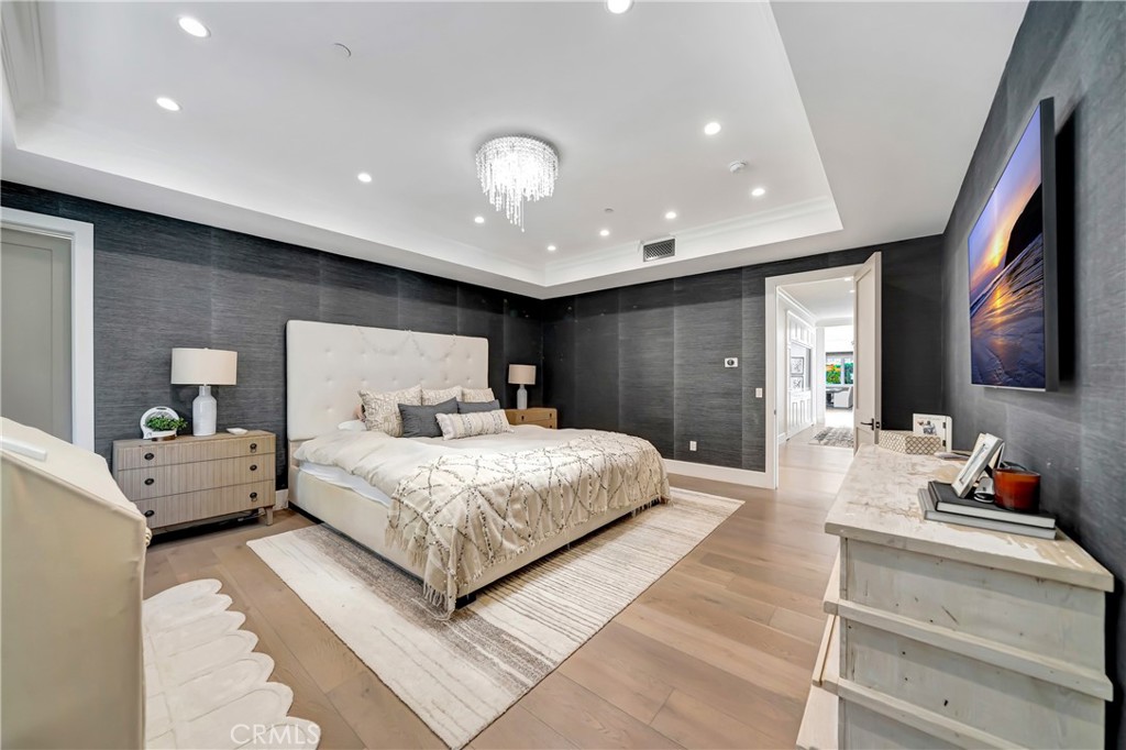 2037 Delphine Lane Calabasas, CA 91302 - Photo 38 of 75 a bedroom with a large bed and a large mirror