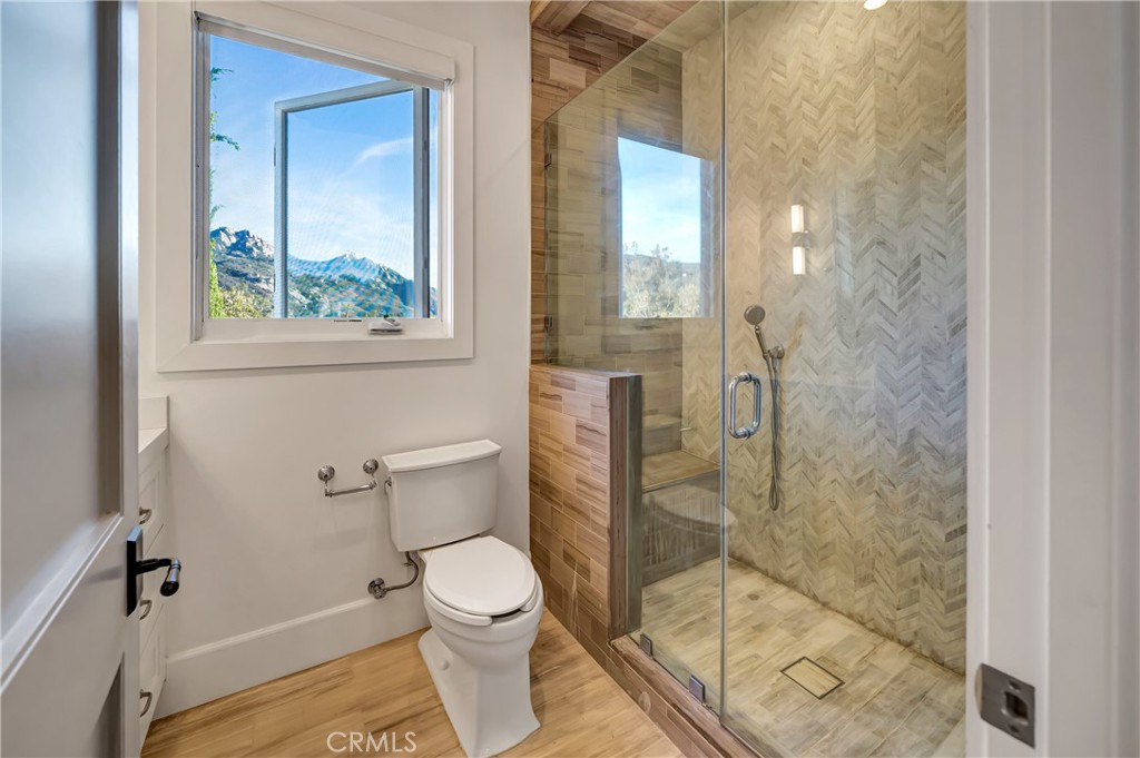 2037 Delphine Lane Calabasas, CA 91302 - Photo 39 of 75 a bathroom with a toilet and a shower