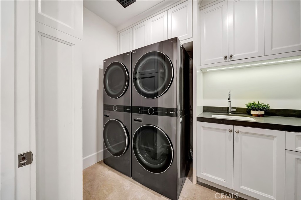 2037 Delphine Lane Calabasas, CA 91302 - Photo 43 of 75 a utility room with sink dryer and washer