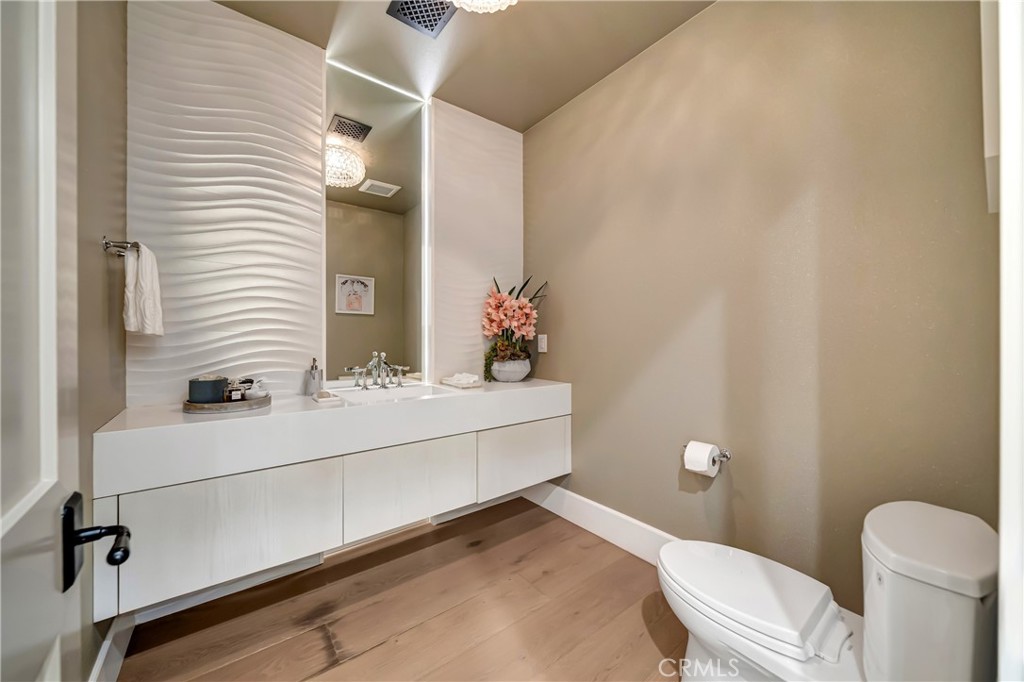 2037 Delphine Lane Calabasas, CA 91302 - Photo 44 of 75 a bathroom with a sink mirror vanity and toilet