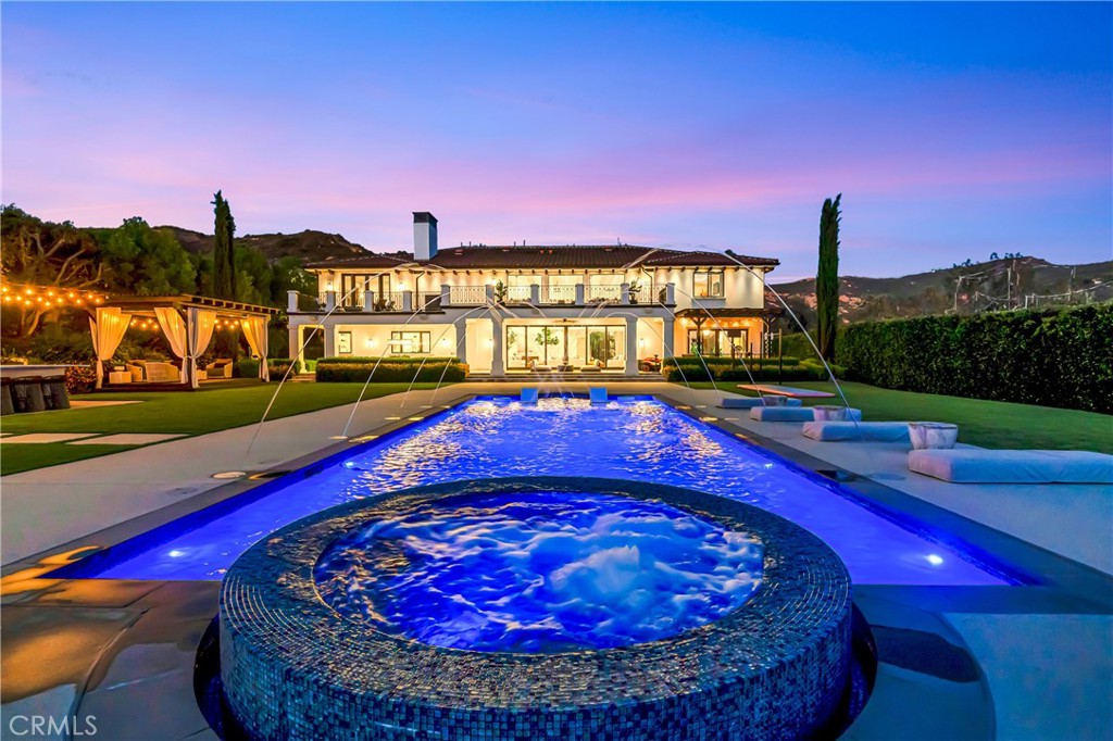 2037 Delphine Lane Calabasas, CA 91302 - Photo 45 of 75 a view of a swimming pool with an outdoor seating