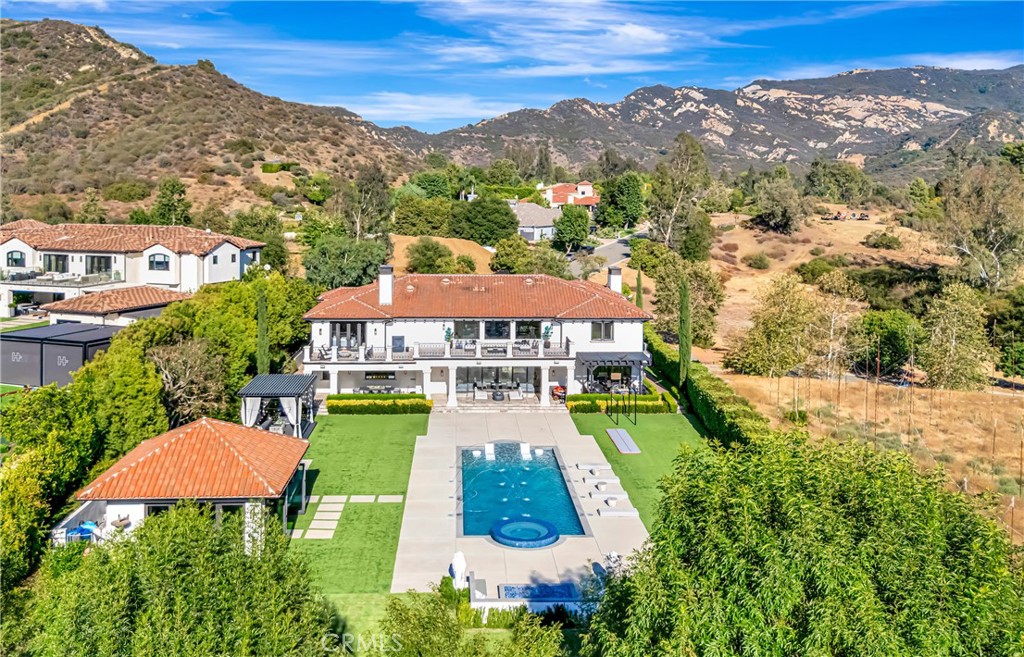 2037 Delphine Lane Calabasas, CA 91302 - Photo 50 of 75 an aerial view of a house with yard swimming pool and mountain view