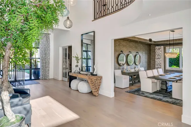 a living room with patio furniture and a large window