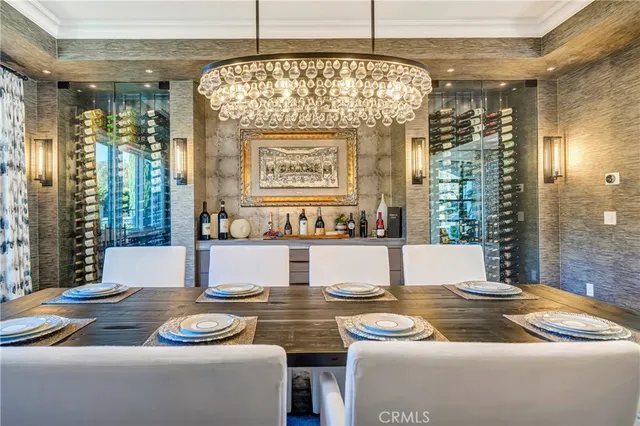 a living room with patio furniture and a large window