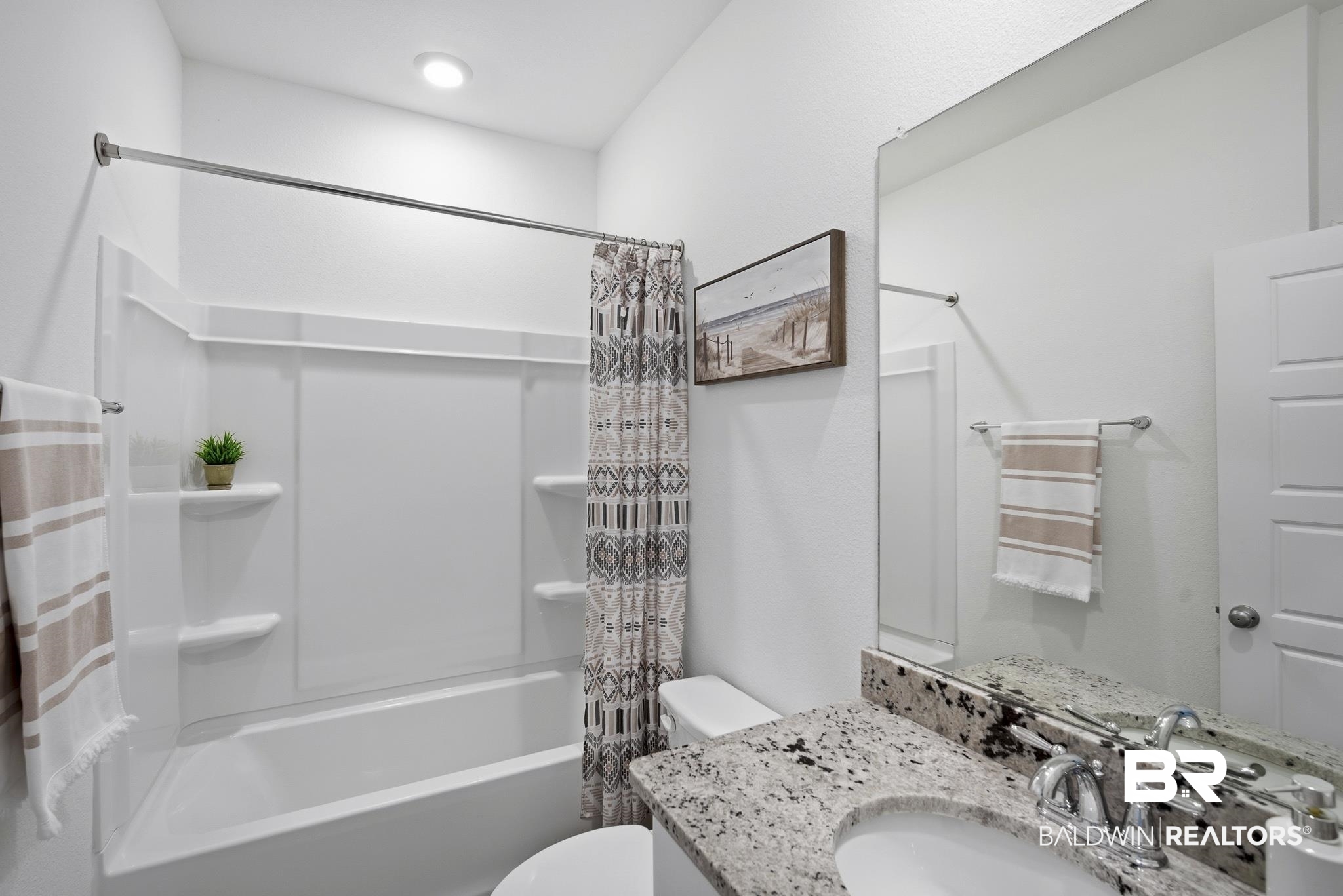 13887 Antler Hl Road Daphne, AL 36527 - Photo 16 of 50 Bathroom featuring shower / bath combo with shower curtain and vanity