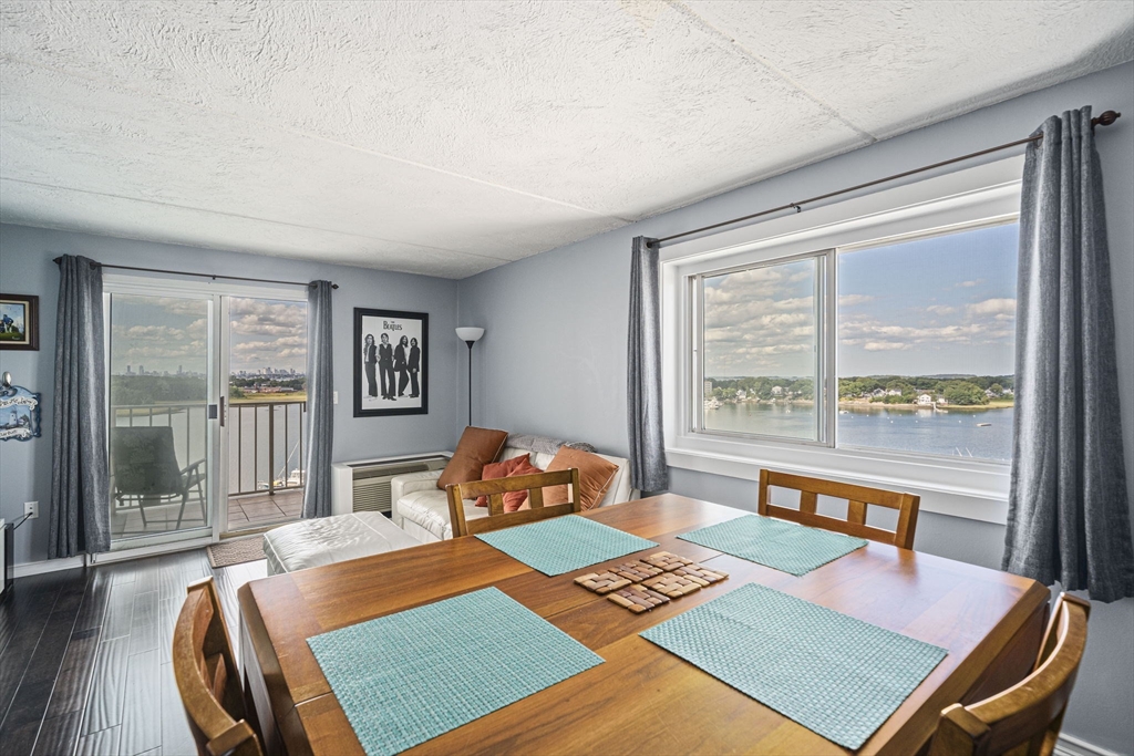 200 Cove Way, Unit 1012 Quincy, MA 02169 - Photo 9 of 26 a room with furniture and a window