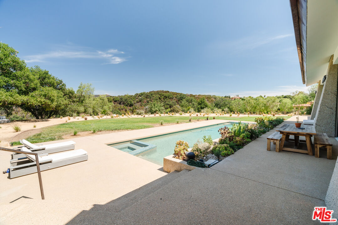 1750 Will Geer Road Topanga, CA 90290 - Photo 15 of 49 a view of swimming pool with a lounge chair
