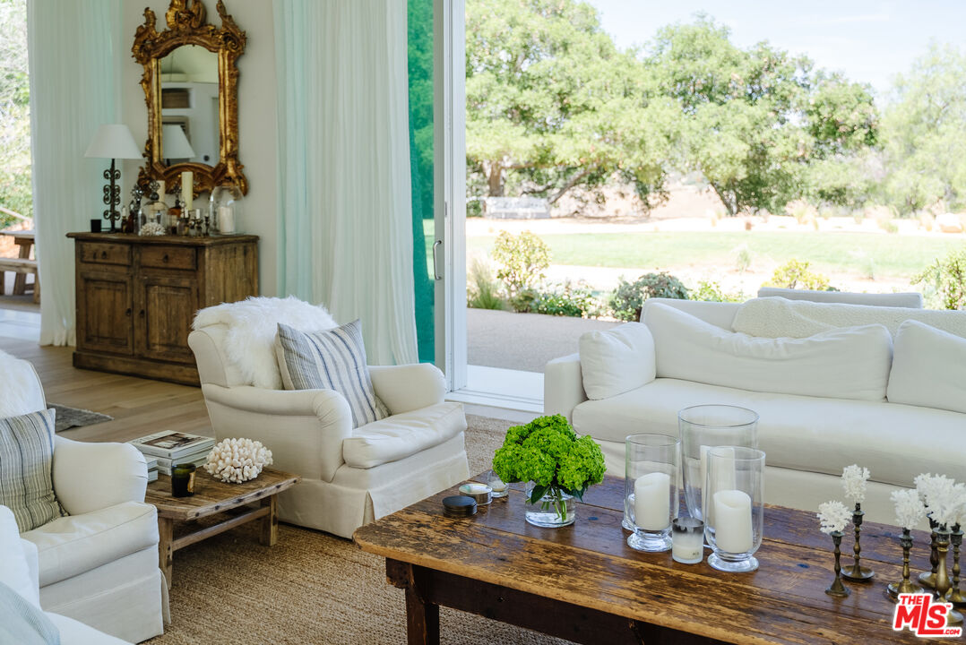 1750 Will Geer Road Topanga, CA 90290 - Photo 3 of 49 a living room with furniture and a table