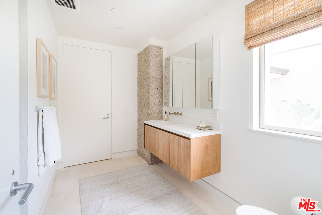 1750 Will Geer Road Topanga, CA 90290 - Photo 39 of 49 a bathroom with a double vanity sink and a mirror