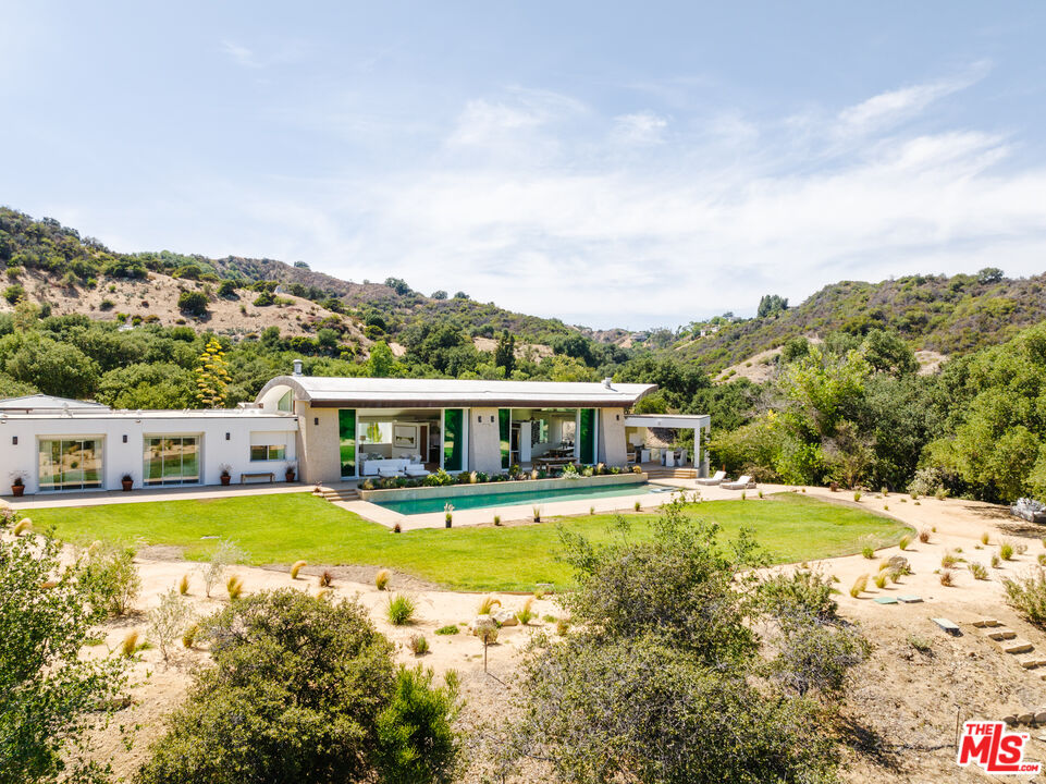 1750 Will Geer Road Topanga, CA 90290 - Photo 43 of 49 a view of a house with a big yard and large trees