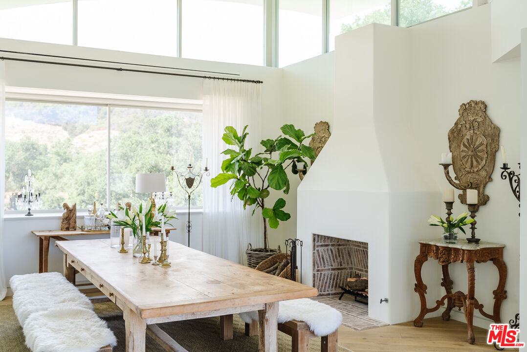 1750 Will Geer Road Topanga, CA 90290 - Photo 10 of 49 a view of a dining table with a potted plant