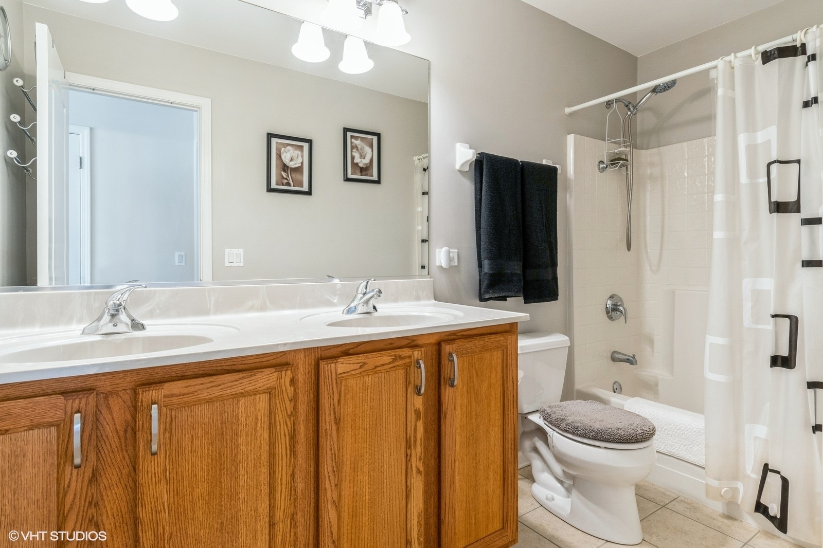11976 Winterberry Lane Plainfield, IL 60585 - Photo 17 of 22 a bathroom with a granite countertop sink toilet and shower