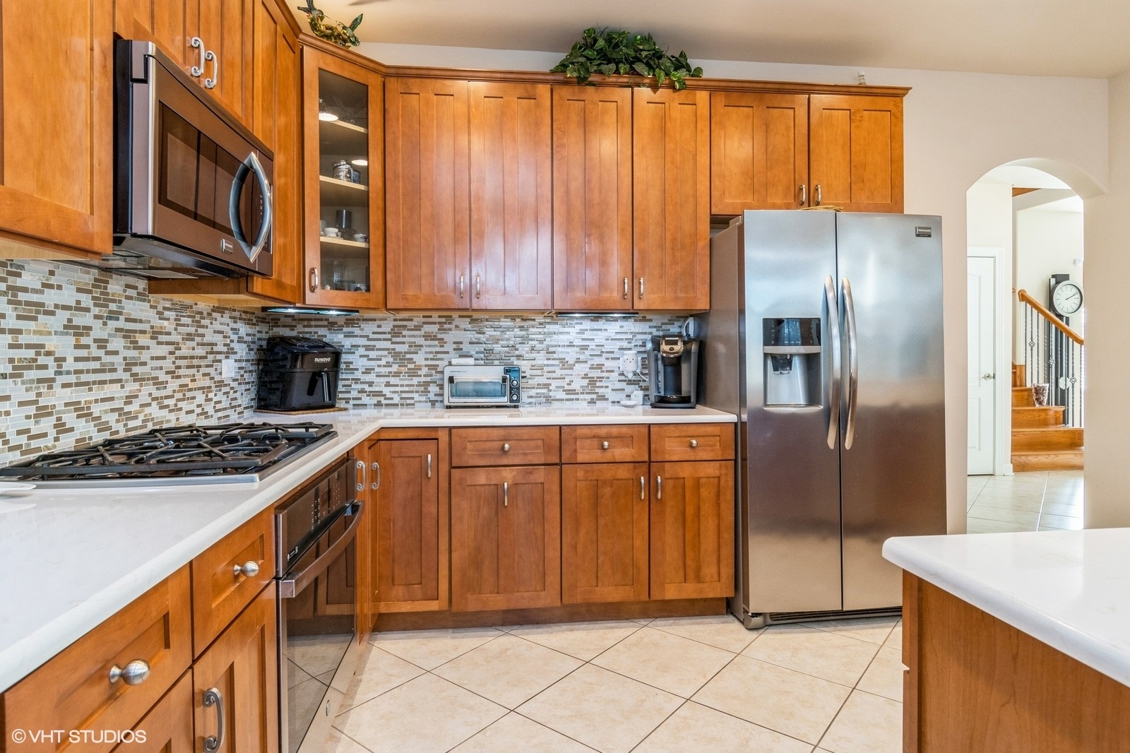 11976 Winterberry Lane Plainfield, IL 60585 - Photo 3 of 22 a kitchen with stainless steel appliances granite countertop a refrigerator a stove a sink and dishwasher