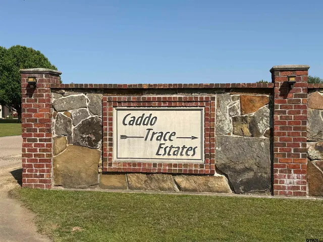 a view of a street with a building in the background