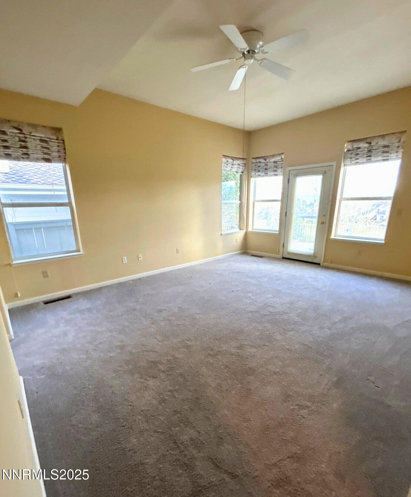 6190 Carriage House Way Reno, NV 89519 - Photo 13 of 26 a view of an empty room with a window