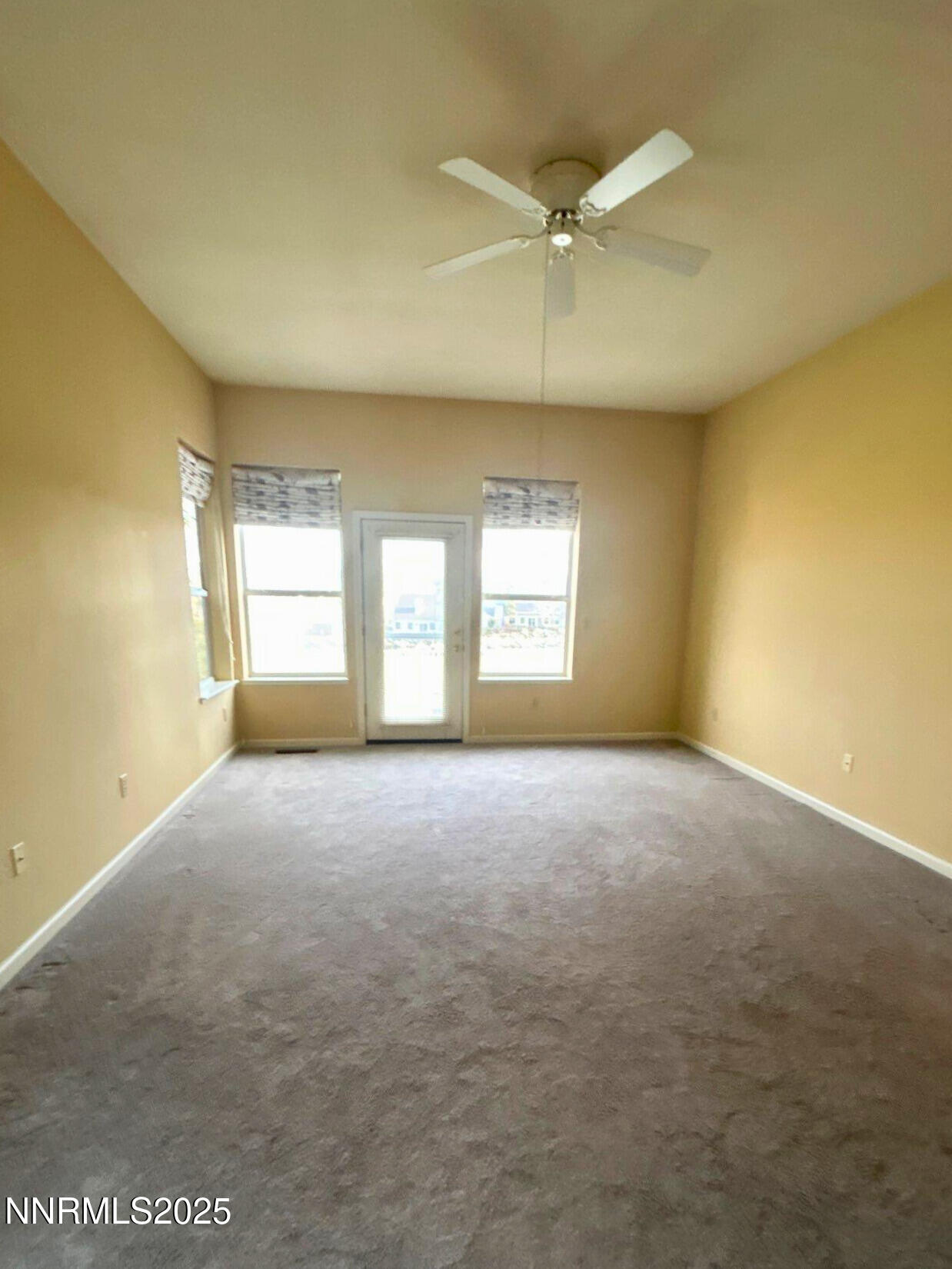 6190 Carriage House Way Reno, NV 89519 - Photo 14 of 26 a view of an empty room with a window
