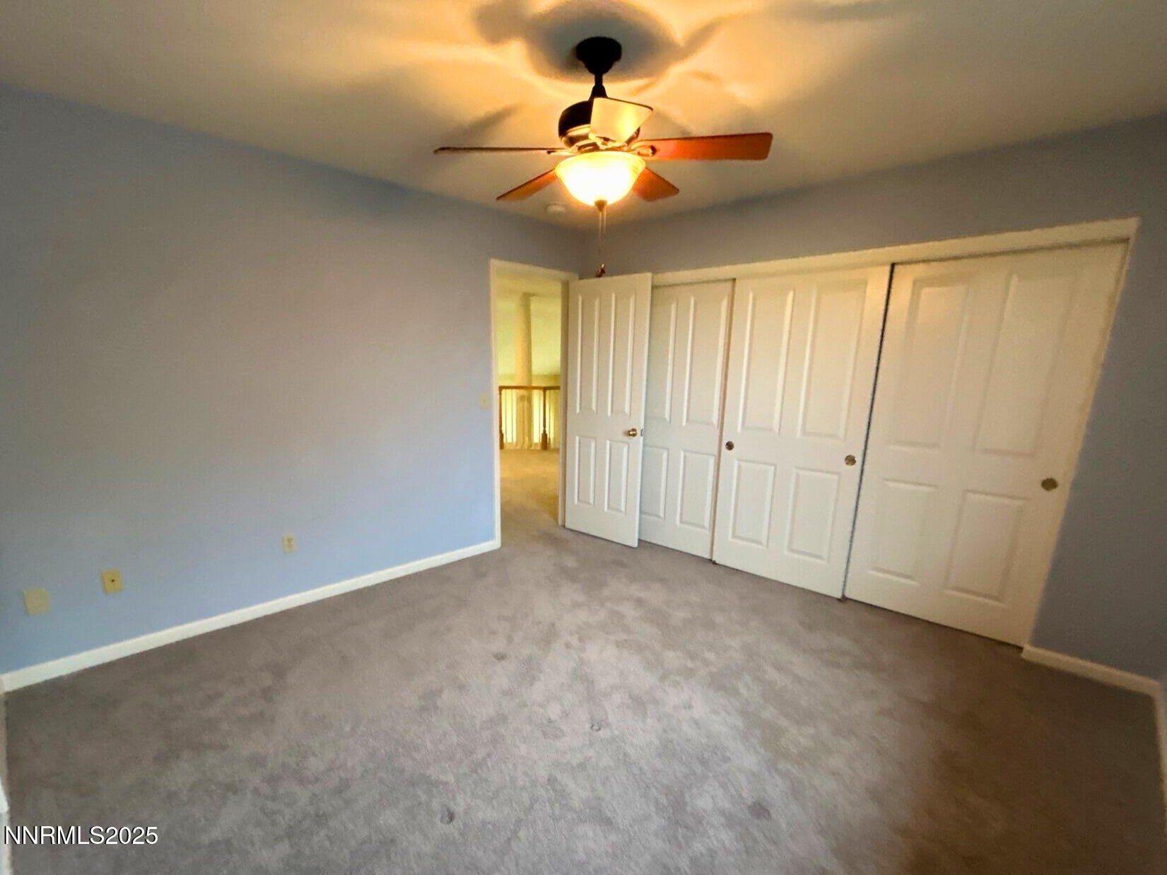 6190 Carriage House Way Reno, NV 89519 - Photo 17 of 26 an empty room with closet and a chandelier fan