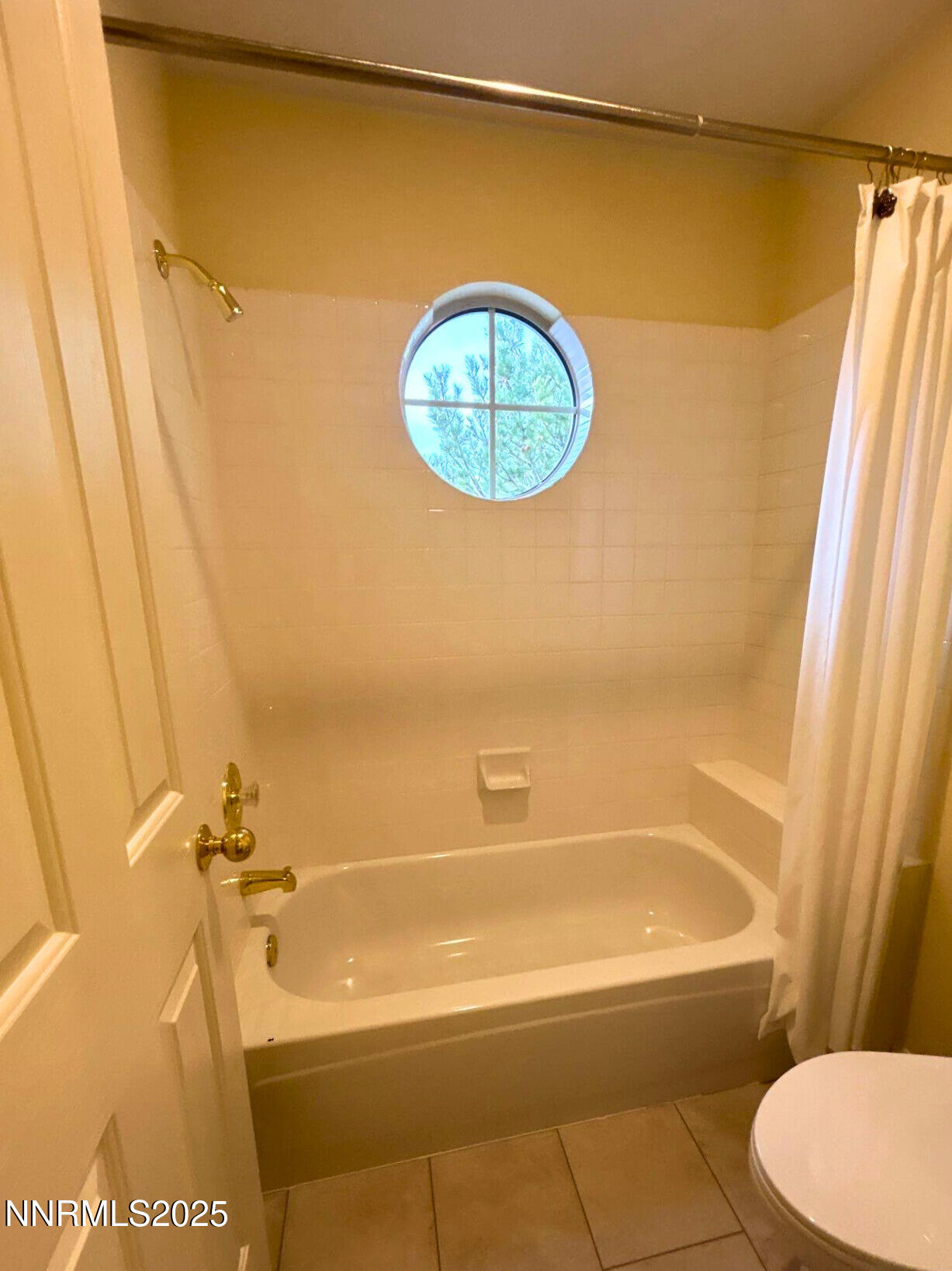 6190 Carriage House Way Reno, NV 89519 - Photo 21 of 26 a bathroom with a tub and a shower