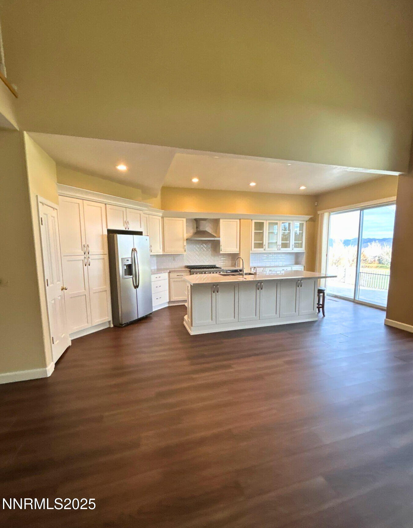 6190 Carriage House Way Reno, NV 89519 - Photo 3 of 26 a large kitchen with stainless steel appliances granite countertop a refrigerator and a large window