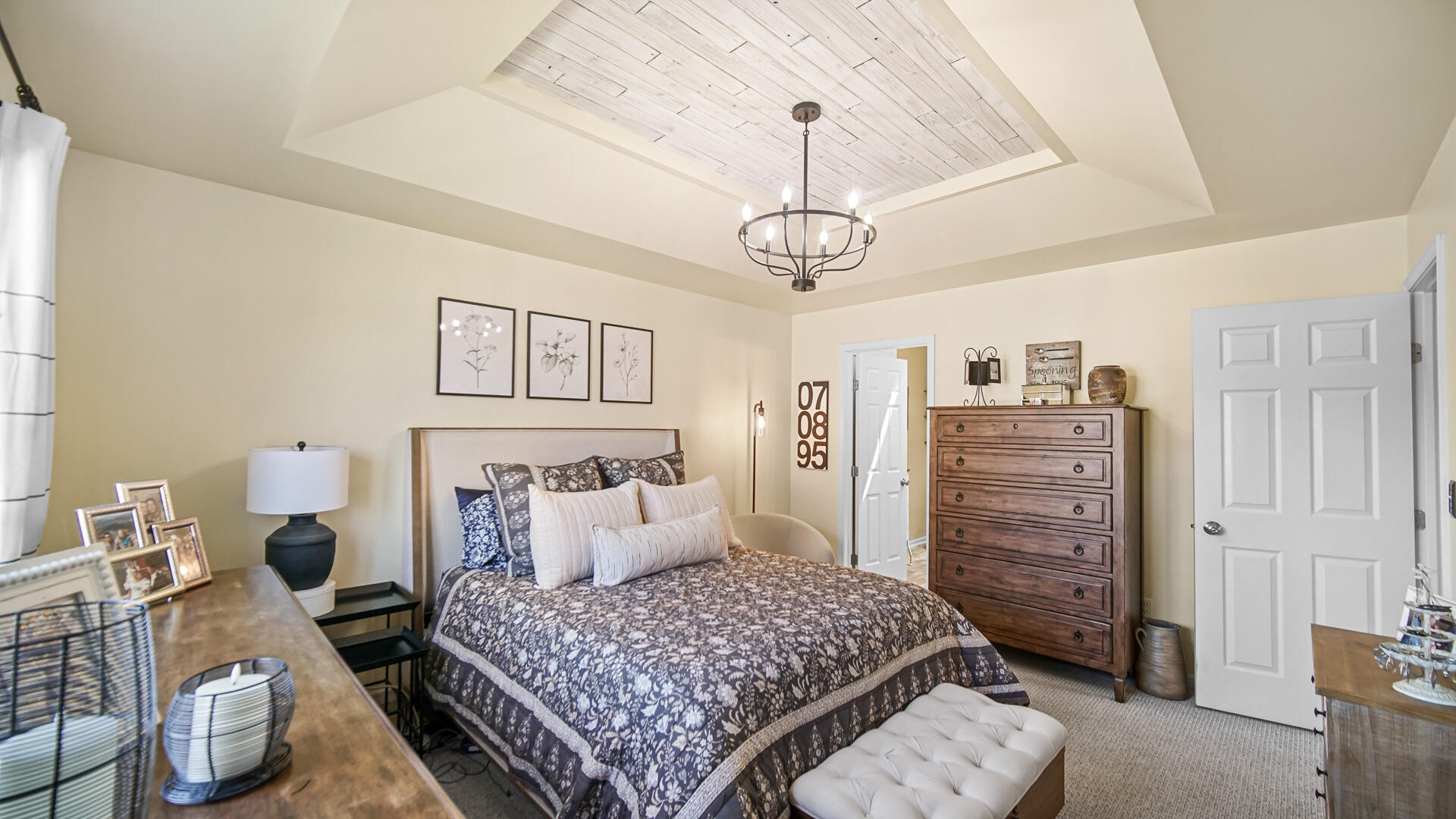 7313 West 91st Place Crown Point, IN 46307 - Photo 13 of 28 a bedroom with a bed chandelier and a window
