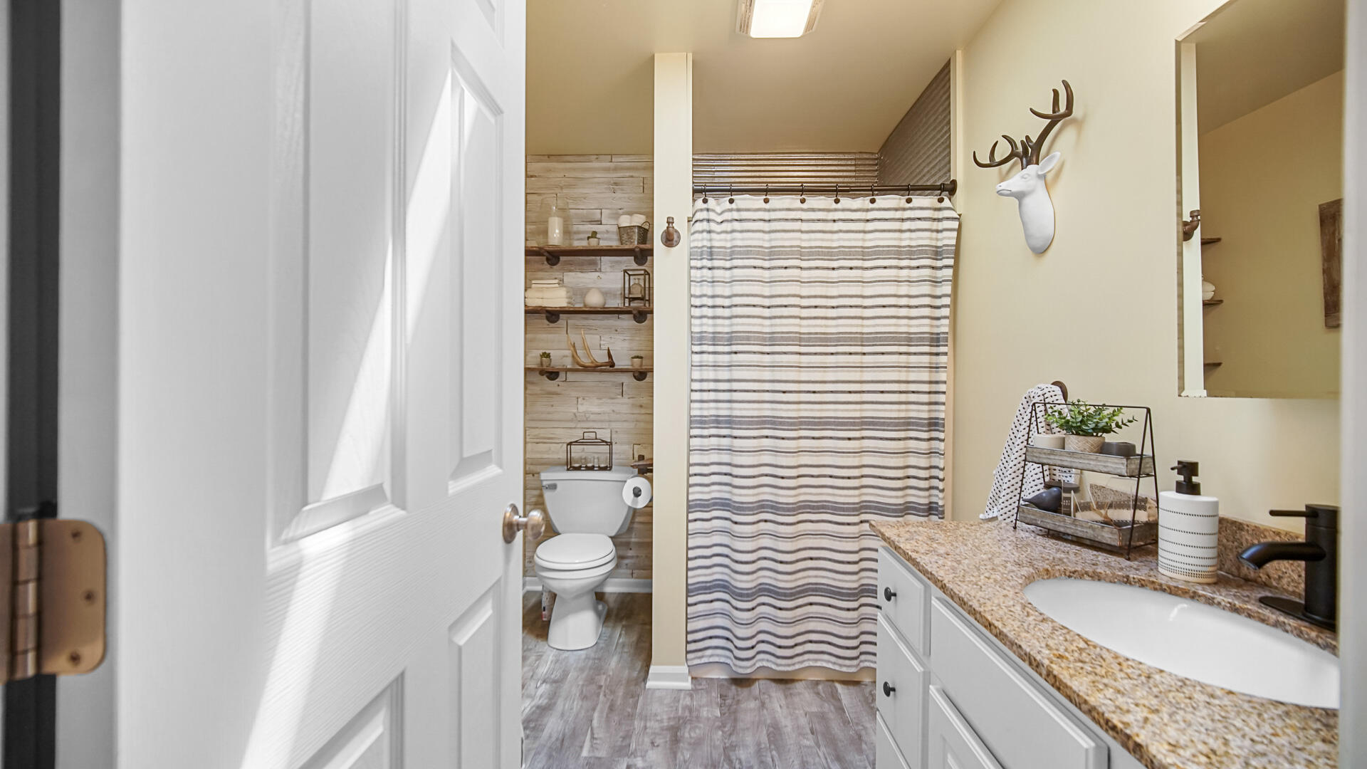 7313 West 91st Place Crown Point, IN 46307 - Photo 14 of 28 a bathroom with a granite countertop sink a toilet and shower