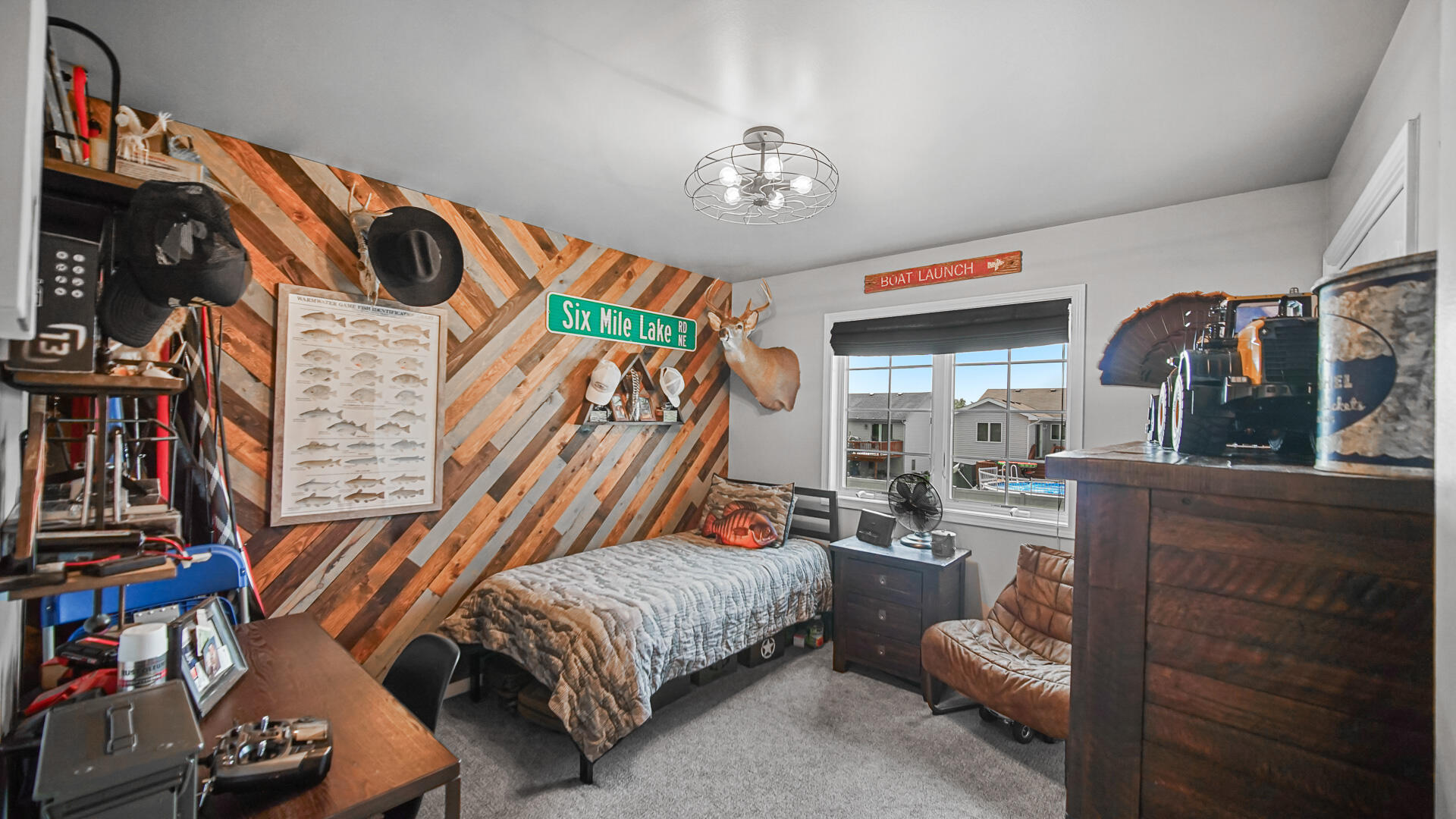 7313 West 91st Place Crown Point, IN 46307 - Photo 15 of 28 a bedroom with a bed and a chandelier