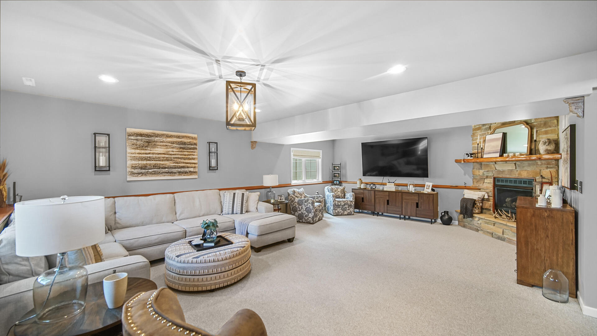 7313 West 91st Place Crown Point, IN 46307 - Photo 18 of 28 a living room with furniture kitchen view and a flat screen tv