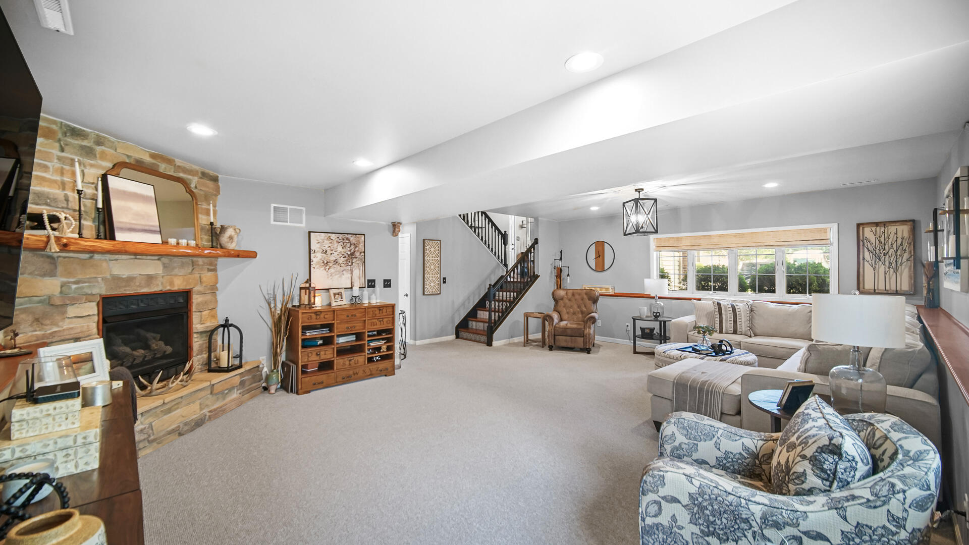 7313 West 91st Place Crown Point, IN 46307 - Photo 19 of 28 a bed room with furniture and a fireplace