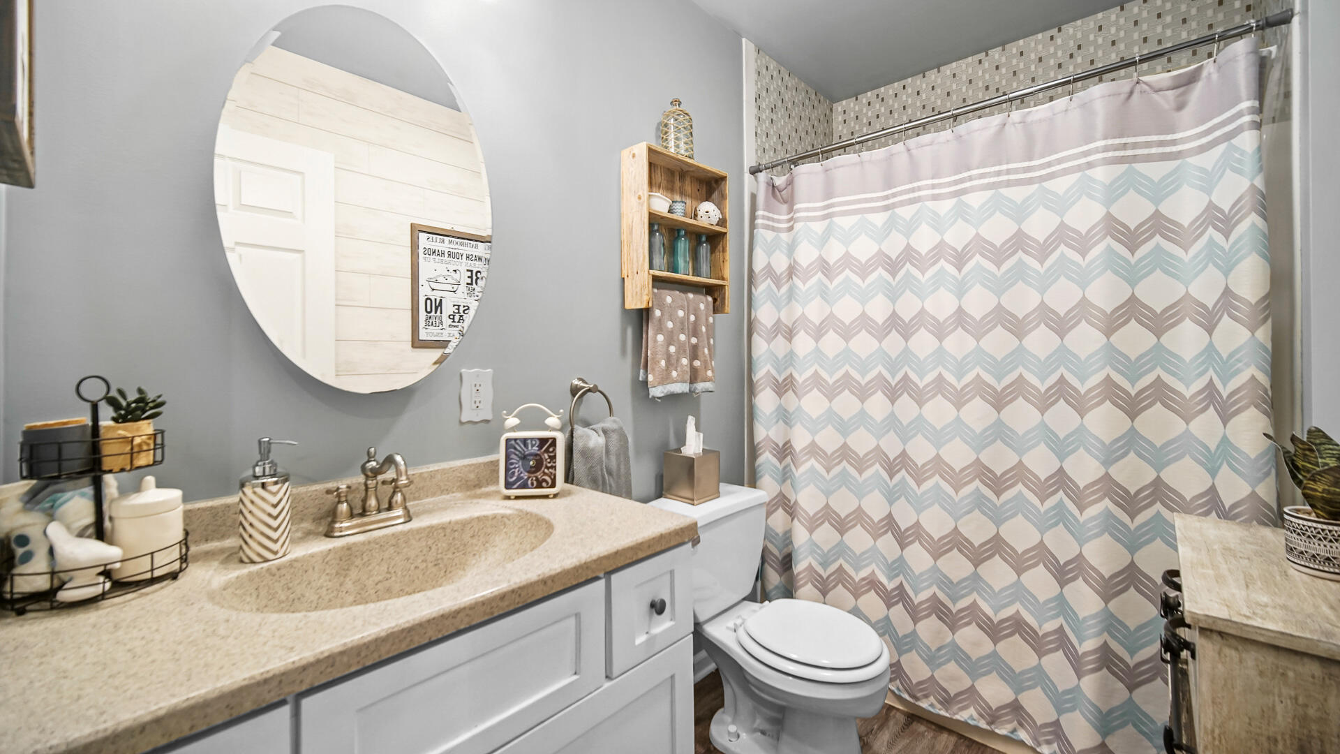 7313 West 91st Place Crown Point, IN 46307 - Photo 22 of 28 a bathroom with a granite countertop sink a toilet and a mirror