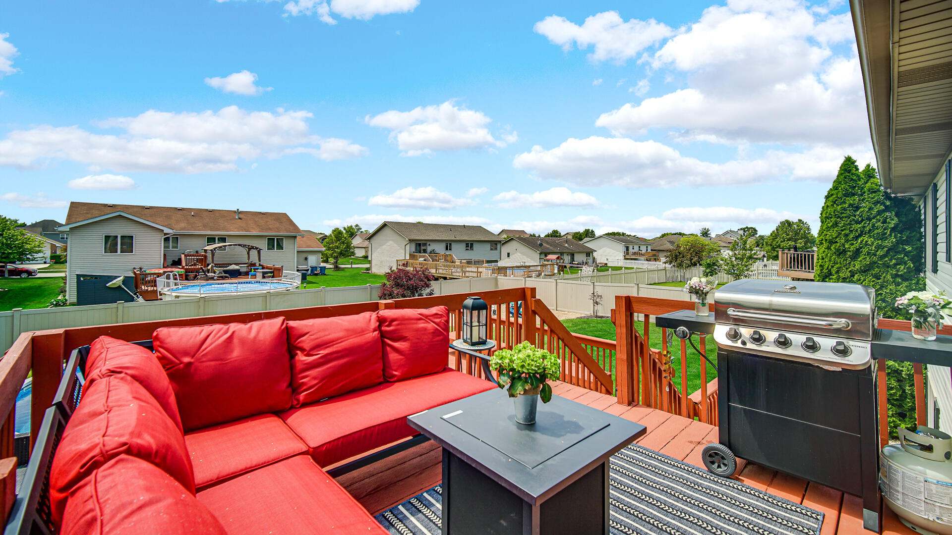 7313 West 91st Place Crown Point, IN 46307 - Photo 24 of 28 a view of a rooftop deck with couch and chairs