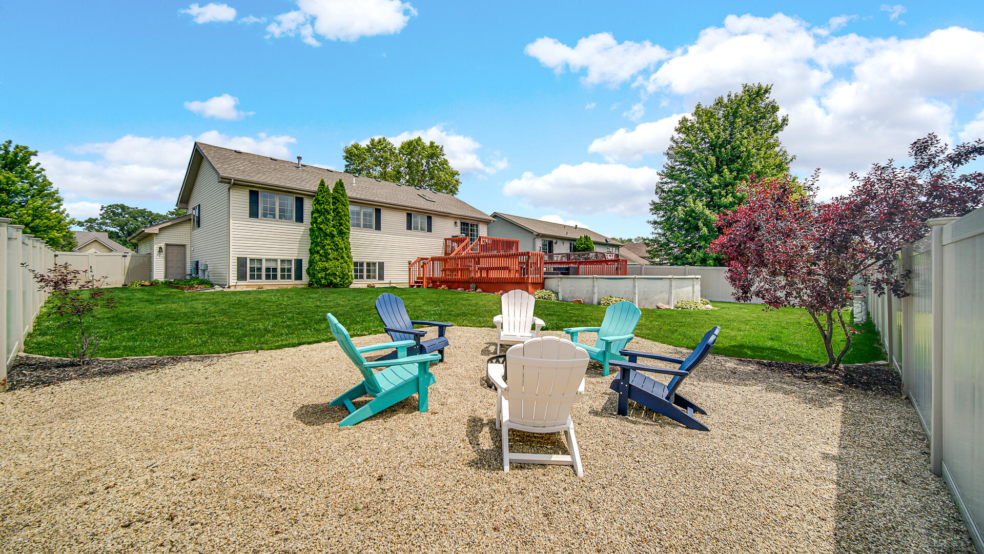 7313 West 91st Place Crown Point, IN 46307 - Photo 27 of 28 a view of a chair and table in backyard of the house