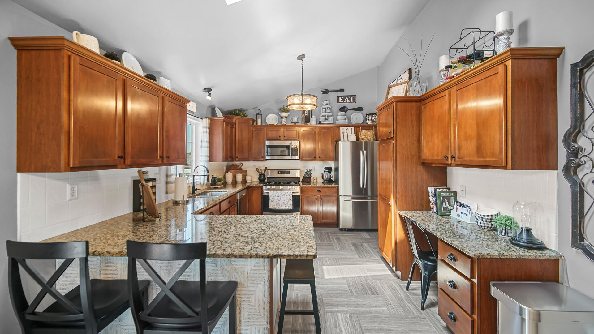 7313 West 91st Place Crown Point, IN 46307 - Photo 7 of 28 a dining room with granite countertop furniture and a chandelier
