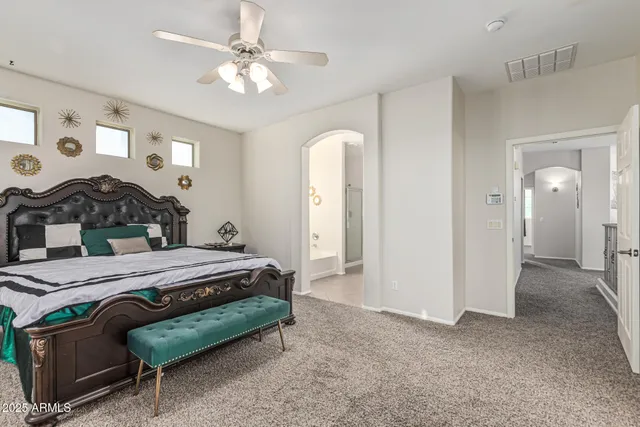 a spacious bathroom with double sink and a mirror