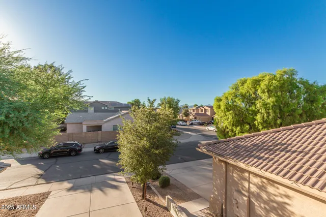 a front view of a house with a yard and porch