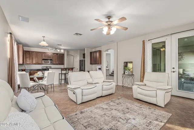 a living room with furniture and white walls
