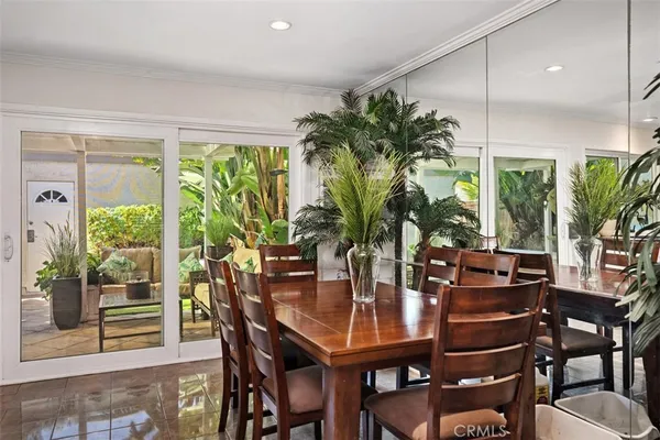 a view of a dining room with furniture and window