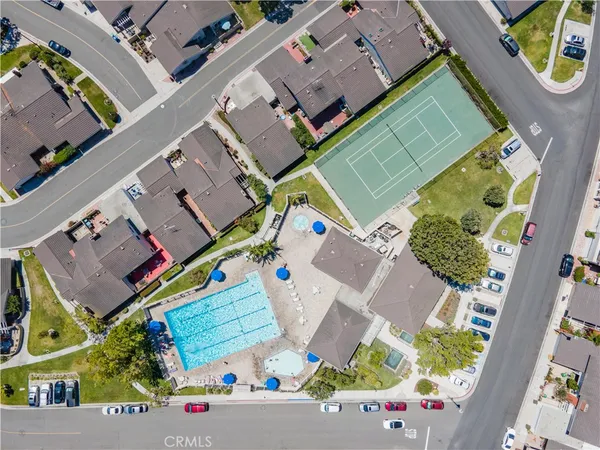 an aerial view of a house with a yard and potted plants