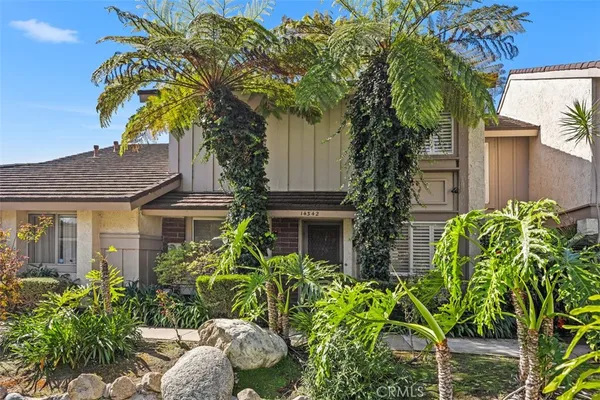 a plant is in front of a house