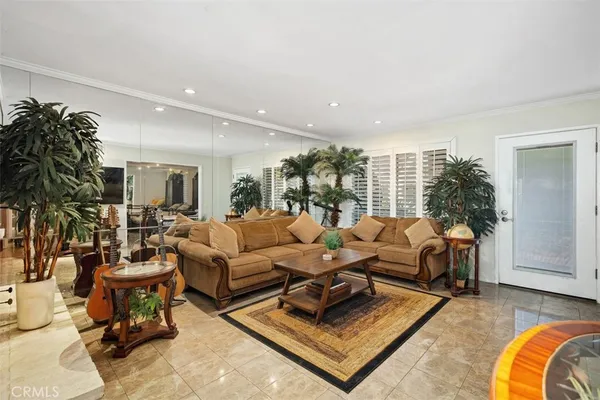 a living room with furniture rug and a large window