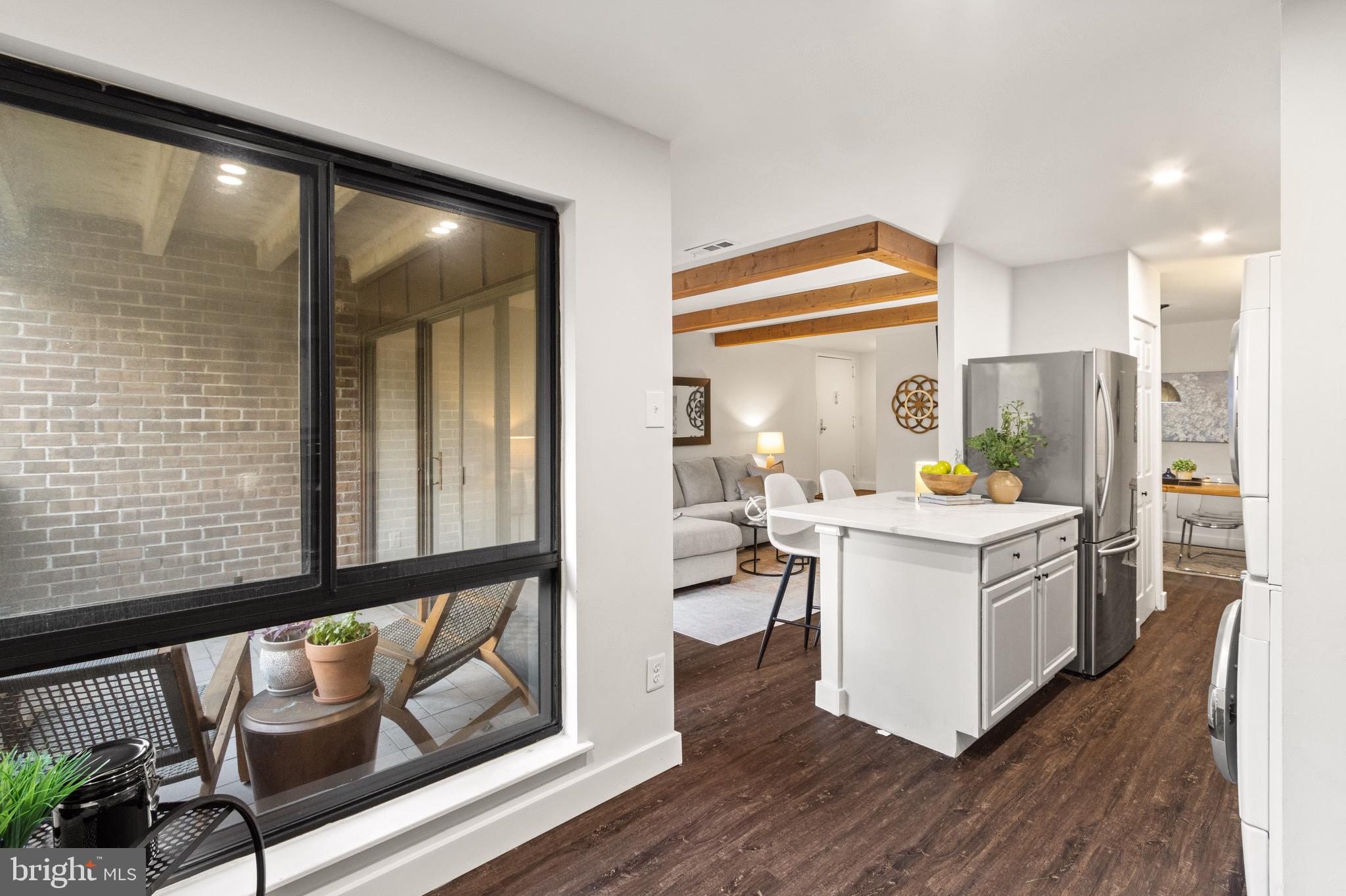 11240 Chestnut Grove Square, Unit 358 Reston, VA 20190 - Photo 11 of 31 a kitchen with a sink and cabinets