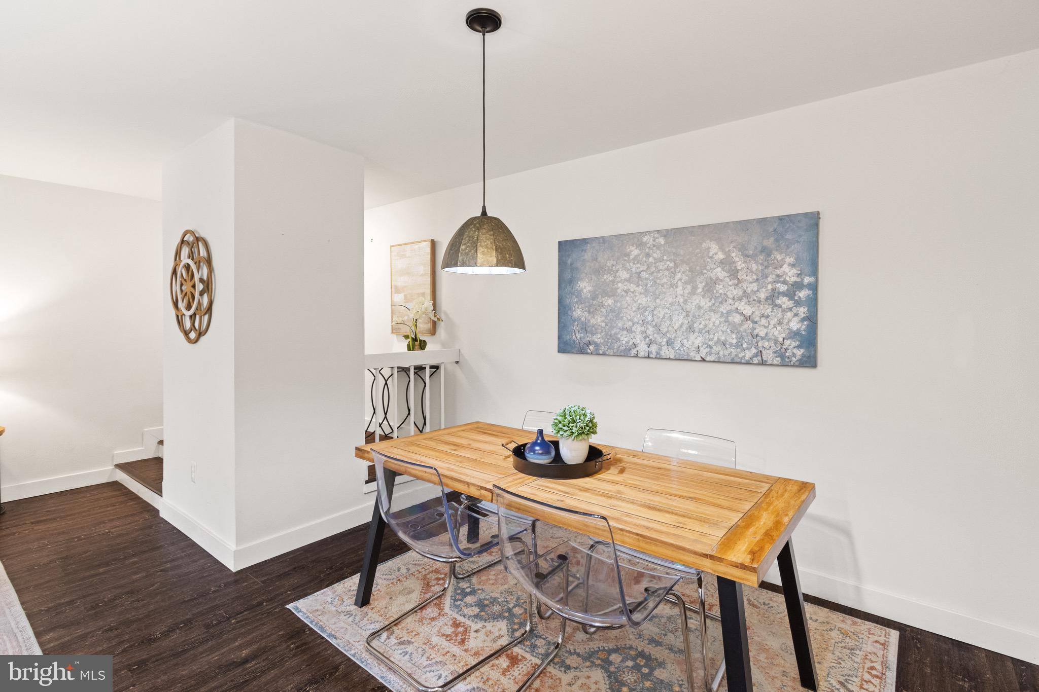 11240 Chestnut Grove Square, Unit 358 Reston, VA 20190 - Photo 15 of 31 a view of a workspace with furniture and wooden floor