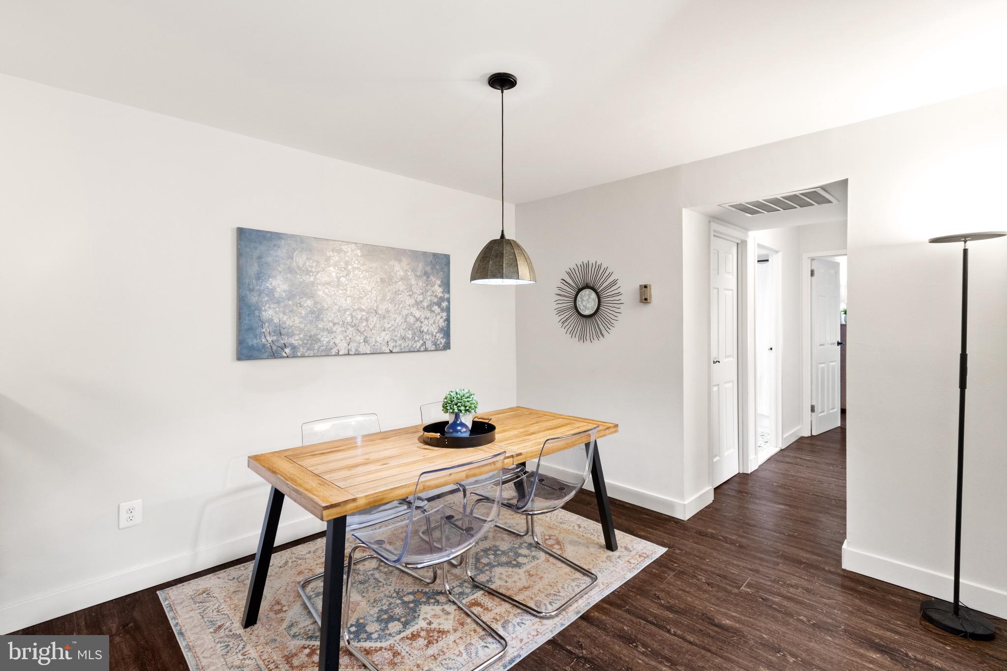 11240 Chestnut Grove Square, Unit 358 Reston, VA 20190 - Photo 17 of 31 a workspace room with furniture and wooden floor